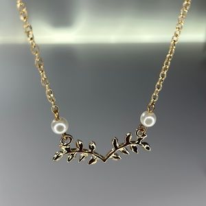 gold long necklace with pearls and leafs